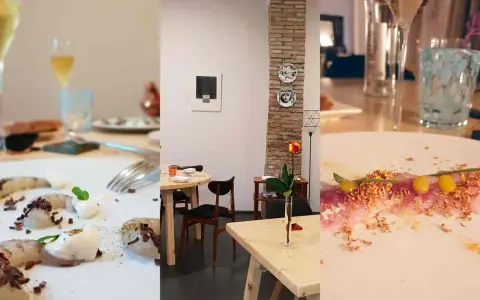 Un'elegante cena in un ristorante a Rimini. Piatti raffinati, bicchieri di vino e un'atmosfera accogliente con dettagli artistici.