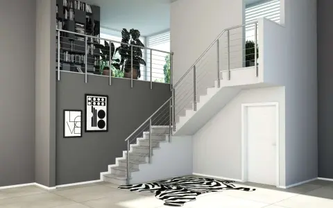 Moderne idee ringhiere scale interne in acciaio inox, con libreria a muro e quadri astratti.