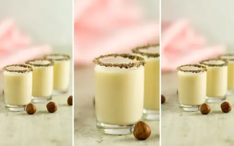 Kremowy likier Monte drink przepis w kieliszkach z orzechami laskowymi i czekoladową posypką.