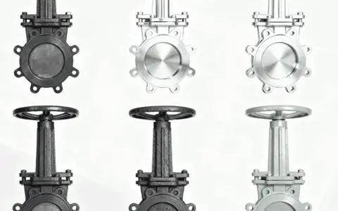 Trois vannes mécaniques, deux en métal sombre, une en métal clair, sur fond blanc.