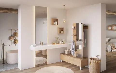 Chambre parentale avec salle de bain épurée, baignoire îlot, double vasque et dressing intégré. Ambiance zen et naturelle.