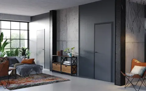 Nowoczesne wnętrze z betonowymi ścianami i drzwiami Porta System, które podkreślają elegancję przestrzeni.