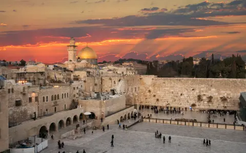 Sunset over Jerusalem's Old City, with the Dome of the Rock and the Western Wall, a glimpse of Solomon's Temple today.