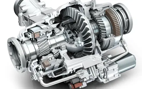 Przekładnia różnicowa z napędem elektrycznym, pokazująca wewnętrzne koła zębate, łożyska i sprzęgło. To jest szpera, co to za mechanizm!