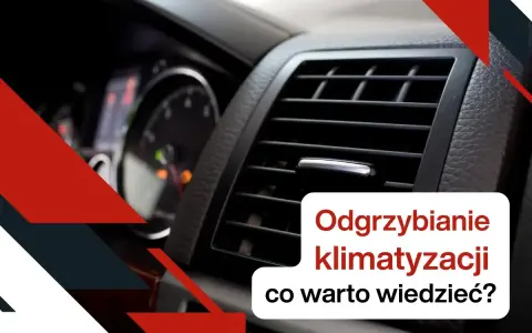 Widok na kratkę nawiewu klimatyzacji samochodowej i deskę rozdzielczą.