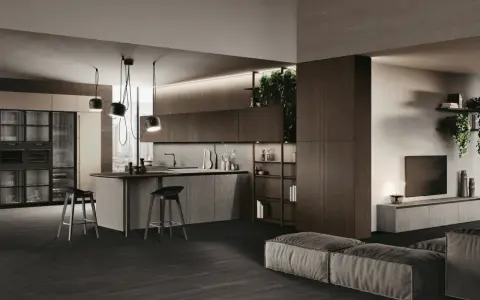 Cuisine en U ouverte sur salon, avec îlot central, tabourets et rangements intégrés. Ambiance moderne et épurée.