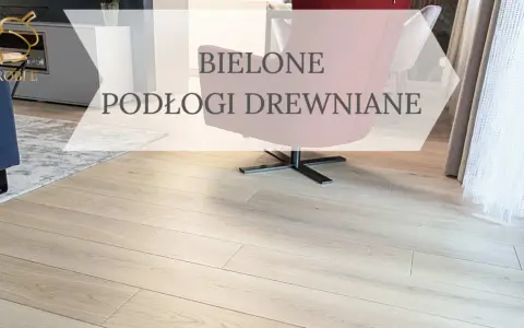 Jasne, bielone podłogi drewniane w nowoczesnym salonie. Wygodny fotel i dywan dopełniają aranżację.