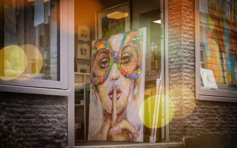 A vibrant painting of a woman in a colorful mask hints why rich people buy art: for beauty, status, and a touch of mystery.