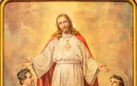 Jezus błogosławi młodego Dominika Savio i innego świętego.