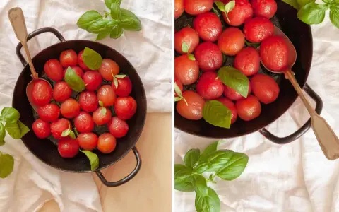 Zarte karamellisierte Tomaten mit frischem Basilikum in einer Pfanne, bereit zum Genießen.
