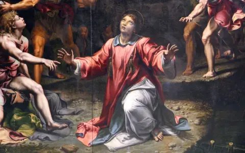 Painting of a saint in a red robe kneeling and looking up, with other figures around.