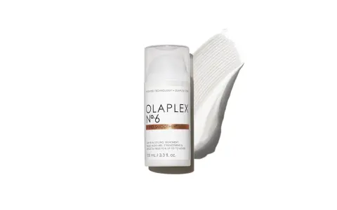 Olaplex N°6 Bond Smoother Flasche mit weißer Creme-Textur daneben.