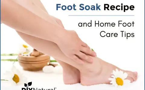 A gentle foot soak recipe for dry feet, with daisies and a candle, promoting natural home foot care.