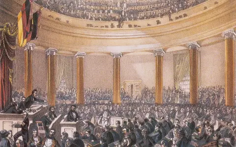 Versammlung im Paulskirchen-Saal, ein wichtiger Moment im zeitstrahl revolution 1848. Männer in Anzügen diskutieren lebhaft.