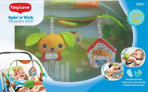 Pałąk Tiny Love Spin 'n' Kick z zabawkami dla niemowląt. Wesoły piesek i domek zachęcają do zabawy.