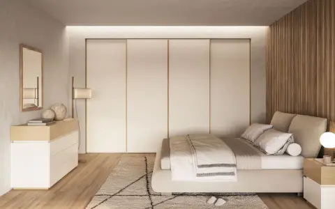 Camera da letto scandinava con letto accogliente, armadio a scomparsa e comò in legno chiaro. Un'oasi di pace in stile nordico.