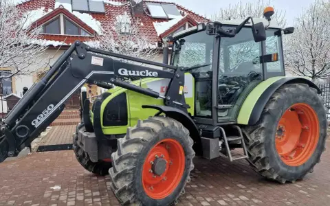Claas Celtis 456 RX z ładowaczem Quicke. Dane techniczne tego wszechstronnego traktora są imponujące, idealny do prac polowych.
