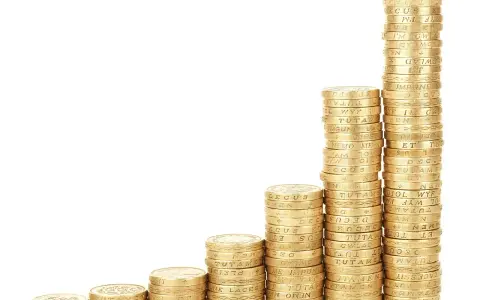 Rosnące stosy monet symbolizują rozwój i sukces finansowy, jak w Svea Ekonomi.