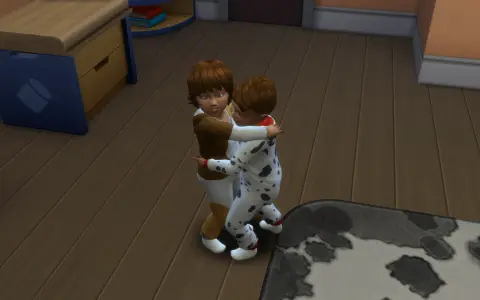 Dzieci w piżamkach przytulają się. W The Sims 4, aby zrobić dziecko, potrzebujesz dorosłych Simów i łóżka.