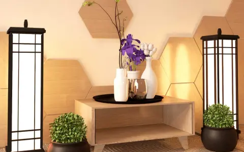 Ideas para como adornar una mesa de salon: dos lámparas, plantas, jarrones con flores y un detalle metálico sobre un mueble de madera.