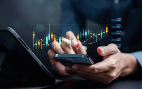 Analiza wykresów finansowych, w tym potencjalnych home depot akcje, na smartfonie.