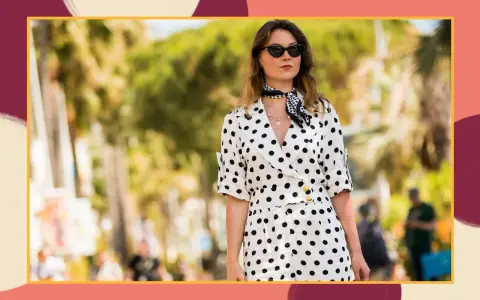 A woman in a stylish polka dot outfit, perfect for inspiration on what to wear to a beach wedding.
