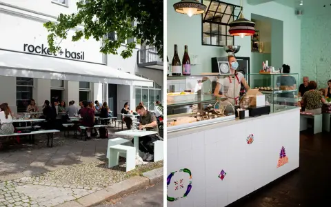 Außenbereich eines Restaurants in Berlin mit Gästen, innen ein Tresen mit einer Mitarbeiterin. Ein gemütliches persisches Restaurant Berlin.