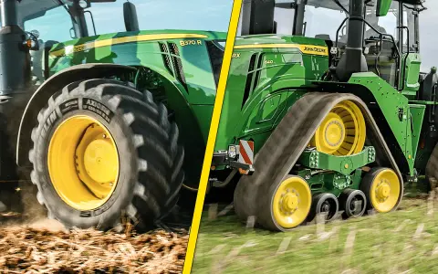 Zielony traktor John Deere z dużymi kołami i gąsienicami. Pokazuje, jak wygląda traktor w akcji na polu.