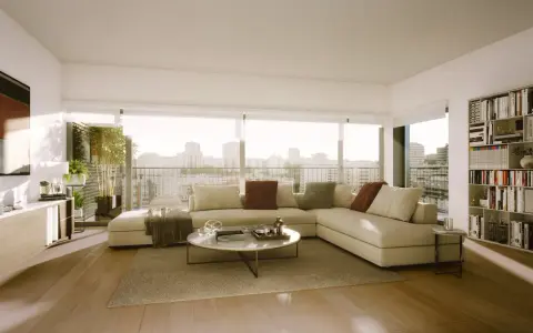 Un salón moderno y luminoso con sofá seccional, mesa de centro, estantería y vistas a la ciudad. ¡Inspírate para diseña tu salón!