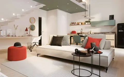 Soggiorno moderno con cucina a vista, ideale per chi cerca un bonus ristrutturazione case vecchie. Tavolini neri, divano chiaro, pouf rosso.
