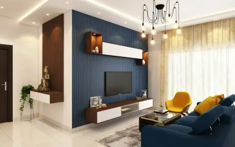 Salones con papel pintado azul rayado, un sofá azul, sillón amarillo y mesa de centro.
