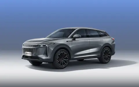Elegancki, szary SUV OMODA 9 hybryda z nowoczesnym designem i czarnymi felgami.