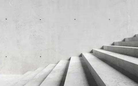 Minimalistyczne schody betonowe, idealne dla tych, którzy szukają, jak tanio wykończyć schody betonowe.