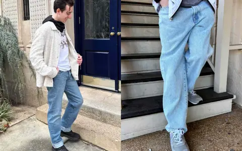 A man models a stylish denim outfit, featuring light-wash jeans and a textured jacket.