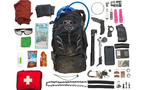 Essential mtb must haves for any adventure: backpack, pump, tools, spare tube, first aid, map, and snacks.