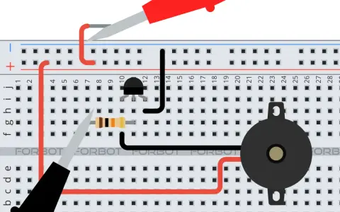 Układ na płytce stykowej z tranzystorem mosfet asg, rezystorem i brzęczykiem.