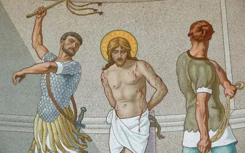 Mosaic depicts Jesus, bleeding from scourging, with two men preparing to inflict more pain. The sangre de cristo is evident.
