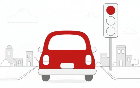 Czerwony samochód ignoruje czerwone światło na sygnalizacji świetlnej, jadąc przez miasto.