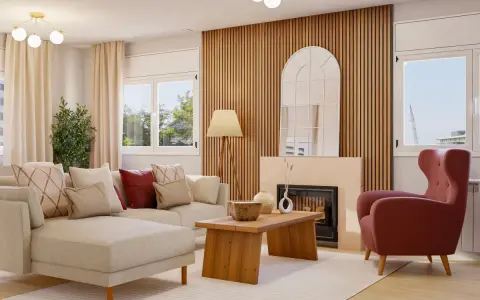 Sofá modular beige, sillón rosa, mesa de centro de madera y chimenea con espejo arqueado. Un espacio con un diseño aesthetic acogedor.