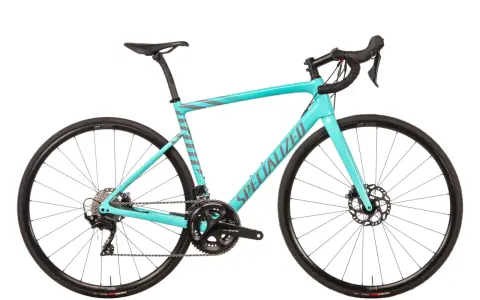 This turquoise Specialized road bike, with its sleek design and disc brakes, proves that specialized bikes are good for performance and style.