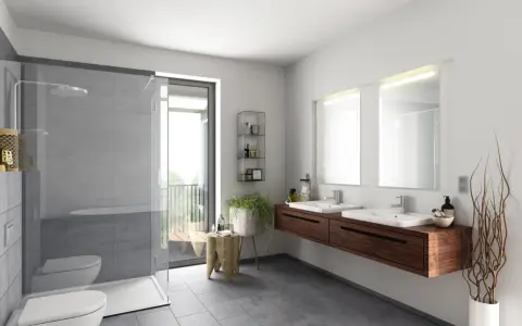 Salle de bain moderne avec douche, double vasque et carrelage gris. Le gris est la couleur la moins salissante pour une salle de bain.
