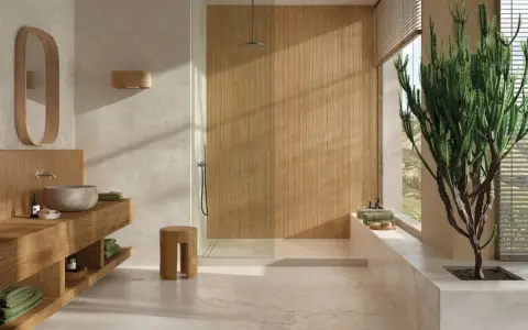Salle de bain zen avec un type de carrelage imitation bois dans la douche et un carrelage clair au sol.