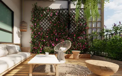 Un angolo relax con divano, tavolino e sedia, circondato da un rigoglioso muro giardino fiorito. Perfette idee muro giardino per un'oasi verde.