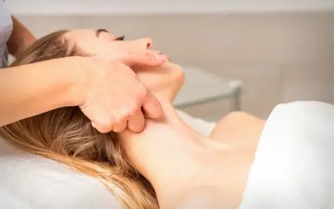 Estheticians can perform lymphatic drainage massage on a client's neck and face, promoting relaxation and fluid movement.