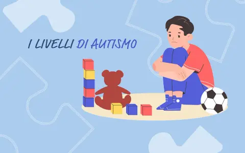 Un bambino con autismo livello 2 gioca con blocchi e un orsacchiotto, mentre un pallone da calcio è vicino.