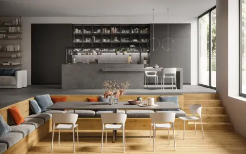 Aménagement moderne d'un salon salle à manger 12m2 avec banquette, table et cuisine ouverte.