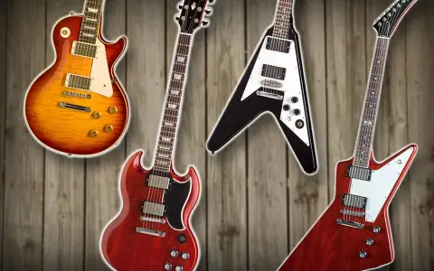 Vier Gibson E-Gitarren: Les Paul, SG, Flying V und Explorer auf Holz Hintergrund.