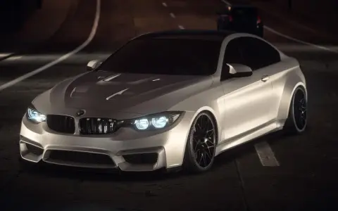 Białe BMW M4 na nocnej trasie, gotowe do wyścigu. To jest najlepszy Need for Speed!