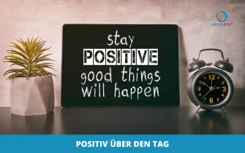 Guten Morgen Affirmationen: Ein Tablet mit der Aufschrift "stay POSITIVE good things will happen" neben einer Topfpflanze und einem Wecker.