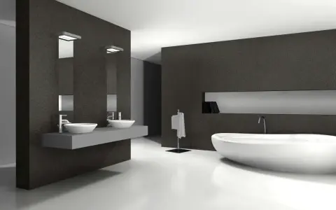 Élégante salle de bain blanc et noir avec baignoire îlot, double vasque et porte-serviettes.